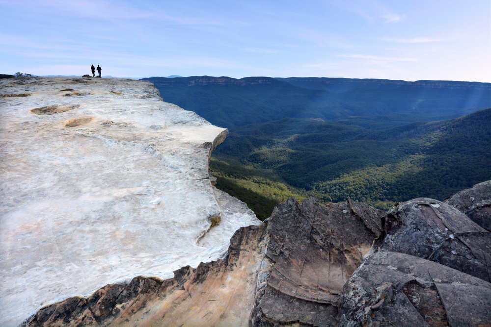 Unrecognizable,People,Hikes,On,Lincoln,Rock,Lookout,At,Sunset,In